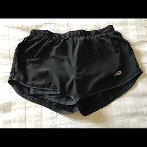 Women’s New Balance black and navy athletic shorts